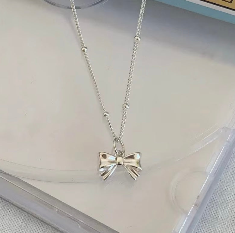Bow-Knot Pendant Necklace in Silver